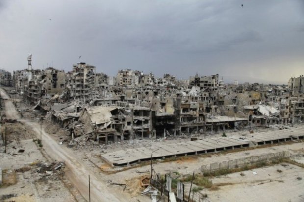 Destroyed buildings are pictured, after the cessation of fighting between rebels and forces loyal to Syria's President Assad, in Homs city